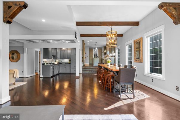 Chandelier, Dining room, Interior, Kitchen, Pendant Lights, Recessed Lighting, Stainless Steel Appliances, Wooden Beams, Wood Texture Flooring