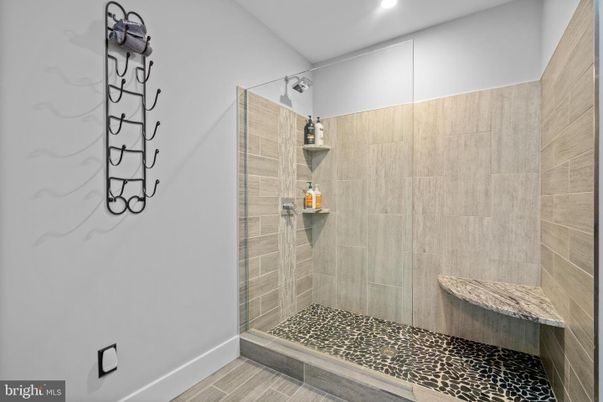 Bathroom, Glass Shower, Interior, Pendant Lights, Recessed Lighting, Wood Texture Flooring