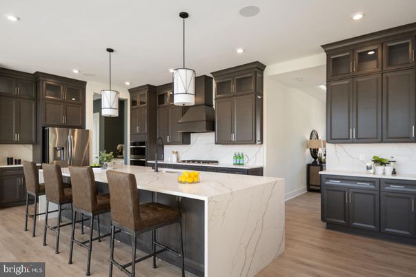 Interior, Kitchen, Marble Walls, Pendant Lights, Recessed Lighting, Stainless Steel Appliances, Wood Texture Flooring