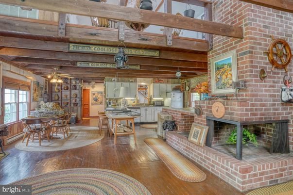 Dining room, Fireplace, Interior, Pendant Lights, Stone Walls, Wooden Beams, Wood Texture Flooring