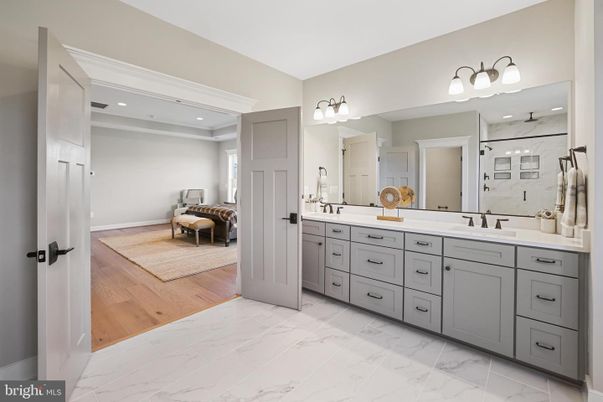 Bathroom, Dual Sink Vanities, Interior, Marble, Recessed Lighting, Wood Texture Flooring