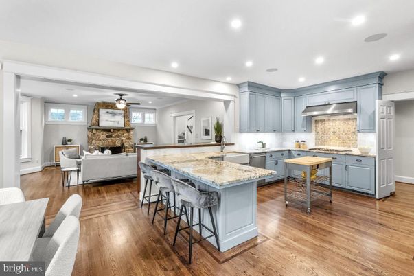 Fireplace, Interior, Kitchen, Living room, Recessed Lighting, Stainless Steel Appliances, Stone Walls, Wood Texture Flooring