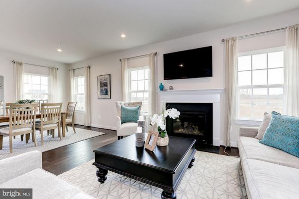 Dining room, Fireplace, Interior, Living room, Recessed Lighting, Wood Texture Flooring