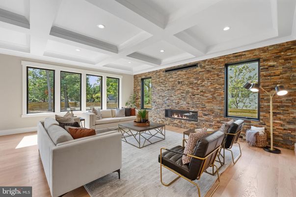 Fireplace, Interior, Living room, Recessed Lighting, Stone Walls, Wood Texture Flooring