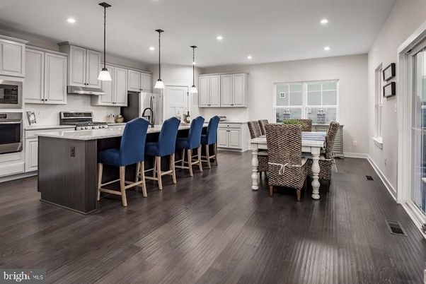 Dining room, Interior, Kitchen, Pendant Lights, Recessed Lighting, Stainless Steel Appliances, Wood Texture Flooring