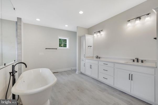 Bathroom, Dual Sink Vanities, Free Standing Baths, Interior, Recessed Lighting, Wood Texture Flooring