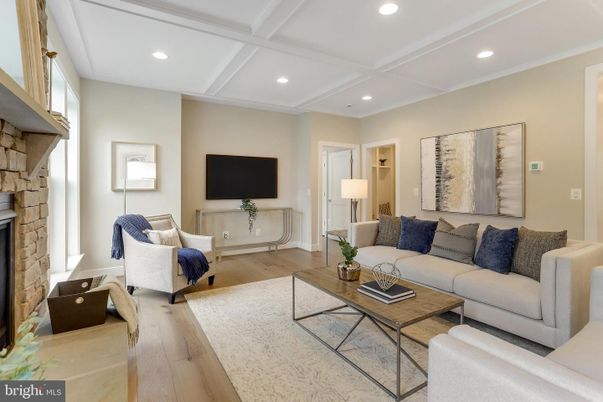 Fireplace, Interior, Living room, Recessed Lighting, Stone Walls, Wood Texture Flooring