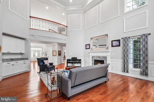 Fireplace, Interior, Living room, Piano, Recessed Lighting, Wood Texture Flooring