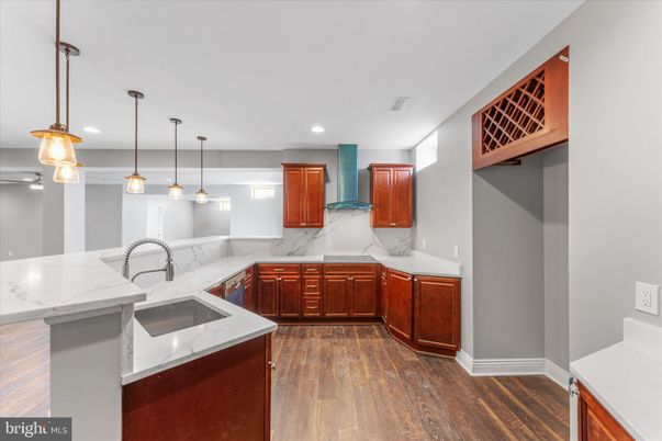 Interior, Kitchen, Marble Walls, Pendant Lights, Recessed Lighting, Wood Texture Flooring