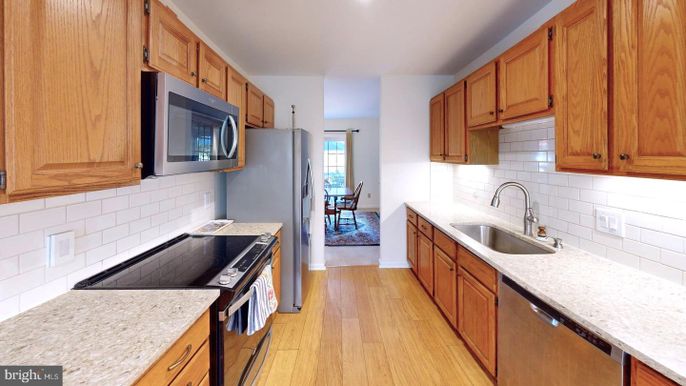 Dining room, Interior, Kitchen, Recessed Lighting, Stainless Steel Appliances, Wood Texture Flooring