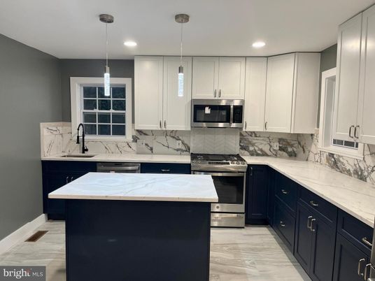 Interior, Kitchen, Marble, Marble Walls, Pendant Lights, Recessed Lighting, Stainless Steel Appliances