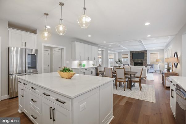 Dining room, Fireplace, Interior, Kitchen, Living room, Pendant Lights, Recessed Lighting, Stainless Steel Appliances, Wood Texture Flooring