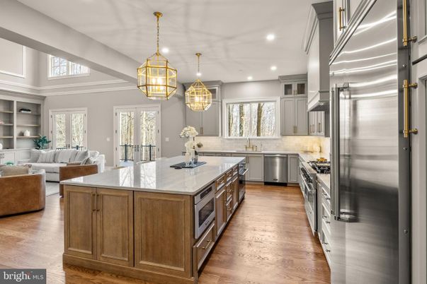 Chandelier, Interior, Kitchen, Living room, Pendant Lights, Recessed Lighting, Stainless Steel Appliances, Wood Texture Flooring