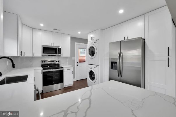 Interior, Kitchen, Recessed Lighting, Stainless Steel Appliances, Washer, Wood Texture Flooring