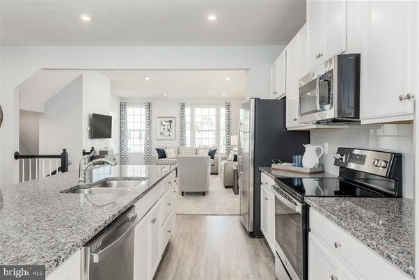 Dining room, Interior, Kitchen, Living room, Recessed Lighting, Stainless Steel Appliances, Wood Texture Flooring