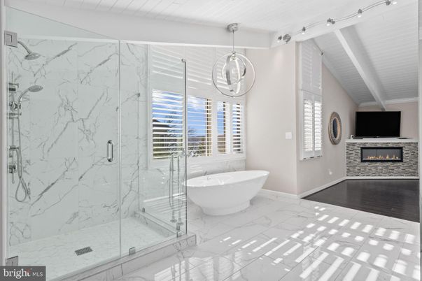 Bathroom, Fireplace, Free Standing Baths, Glass Shower, Interior, Marble, Marble Walls, Pendant Lights, Wood Texture Flooring