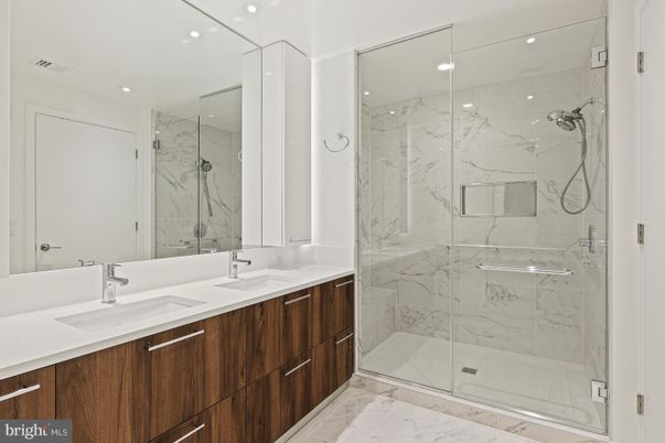 Bathroom, Dual Sink Vanities, Glass Shower, Interior, Marble, Marble Walls, Recessed Lighting