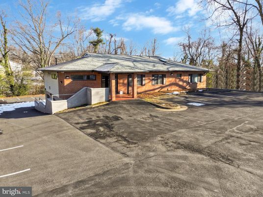 Exterior, Facade, Brick Facade, Solar Panels, Log Home