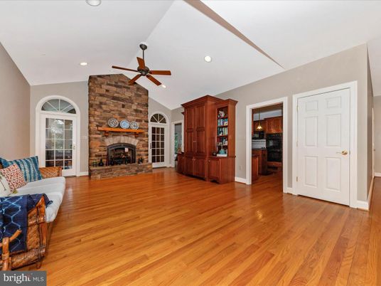 Empty room, Fireplace, Interior, Recessed Lighting, Stone Walls, Wood Texture Flooring