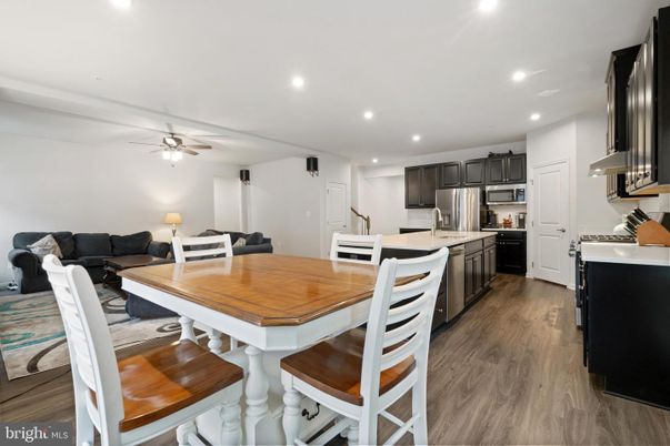 Dining room, Interior, Kitchen, Living room, Recessed Lighting, Stainless Steel Appliances, Wood Texture Flooring