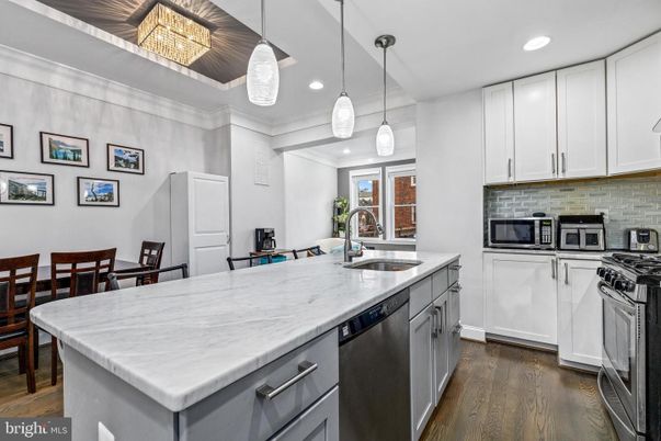 Dining room, Interior, Kitchen, Pendant Lights, Recessed Lighting, Stainless Steel Appliances, Wood Texture Flooring