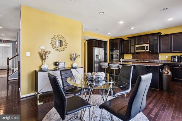 Dining room, Interior, Kitchen, Recessed Lighting, Stainless Steel Appliances, Wood Texture Flooring