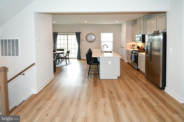 Dining room, Interior, Kitchen, Recessed Lighting, Stainless Steel Appliances, Wood Texture Flooring
