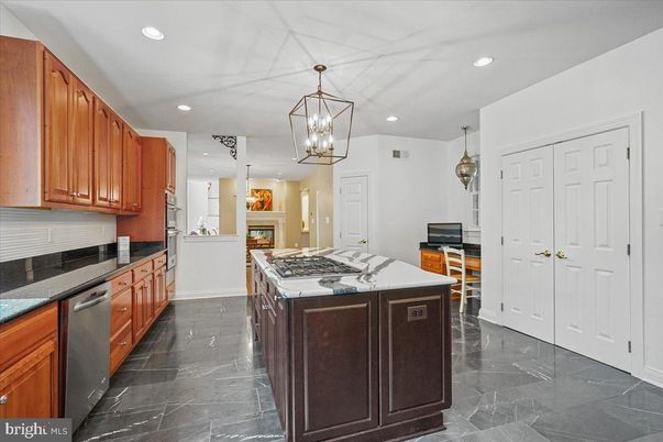 Fireplace, Interior, Kitchen, Marble, Pendant Lights, Recessed Lighting, Stainless Steel Appliances