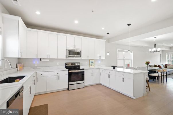 Chandelier, Dining room, Interior, Kitchen, Pendant Lights, Recessed Lighting, Stainless Steel Appliances, Wood Texture Flooring