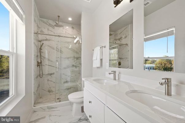 Bathroom, Dual Sink Vanities, Glass Shower, Interior, Marble, Marble Walls, Recessed Lighting