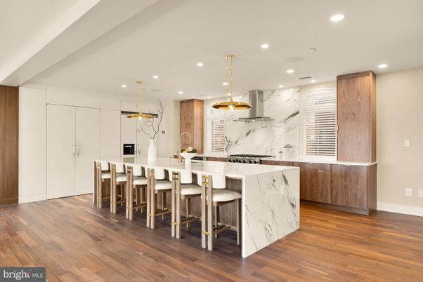 Interior, Kitchen, Marble Walls, Pendant Lights, Recessed Lighting, Stainless Steel Appliances, Wood Texture Flooring