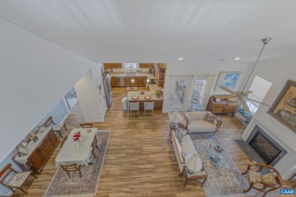 Dining room, Fireplace, Interior, Living room, Pendant Lights, Recessed Lighting, Wood Texture Flooring