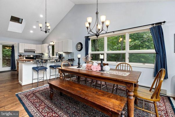 Chandelier, Dining room, Interior, Kitchen, Pendant Lights, Recessed Lighting, Stainless Steel Appliances, Wood Texture Flooring