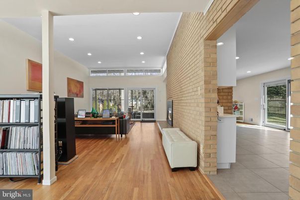 Fireplace, Interior, Living room, Recessed Lighting, Stone Walls, Wood Texture Flooring