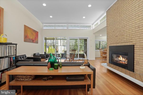 Fireplace, Interior, Living room, Recessed Lighting, Stone Walls, Wood Texture Flooring