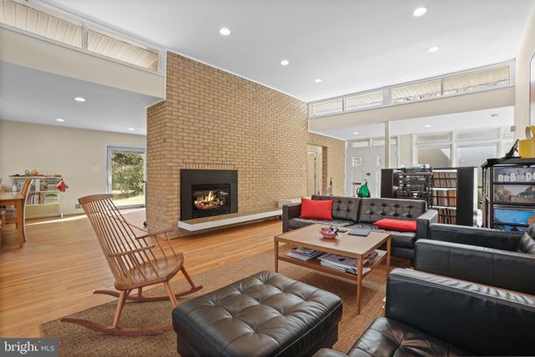Fireplace, Interior, Living room, Recessed Lighting, Stone Walls, Wood Texture Flooring