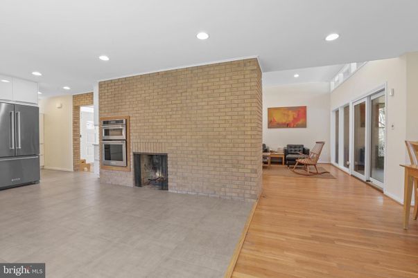 Fireplace, Interior, Kitchen, Recessed Lighting, Stainless Steel Appliances, Stone Walls, Wood Texture Flooring