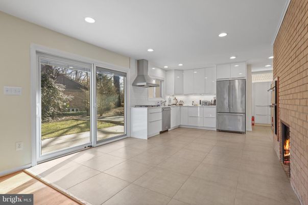 Fireplace, Interior, Kitchen, Recessed Lighting, Stainless Steel Appliances, Stone Walls