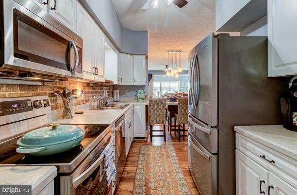 Dining room, Interior, Kitchen, Pendant Lights, Stainless Steel Appliances, Wood Texture Flooring