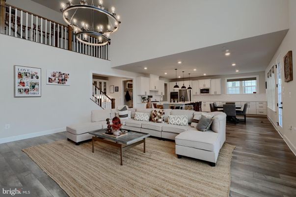 Chandelier, Dining room, Interior, Kitchen, Living room, Pendant Lights, Recessed Lighting, Stainless Steel Appliances, Wood Texture Flooring