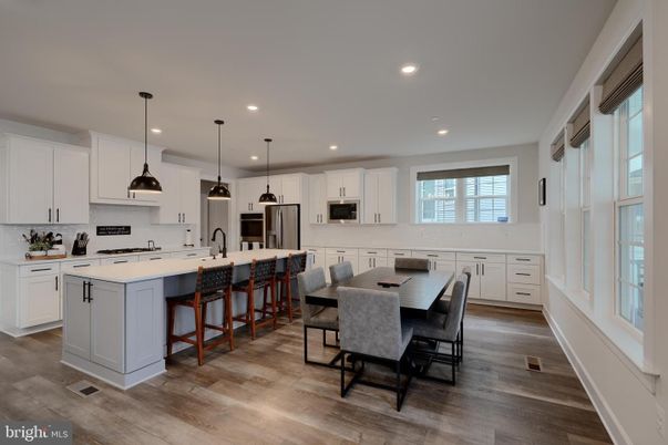 Dining room, Interior, Kitchen, Pendant Lights, Recessed Lighting, Stainless Steel Appliances, Wood Texture Flooring