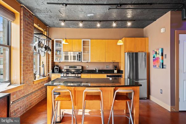 Interior, Kitchen, Pendant Lights, Stainless Steel Appliances, Stone Walls, Wood Texture Flooring