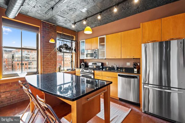 Interior, Kitchen, Pendant Lights, Stainless Steel Appliances, Stone Walls, Wood Texture Flooring
