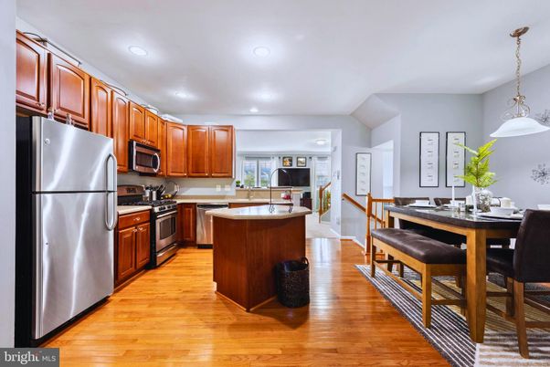 Dining room, Interior, Kitchen, Pendant Lights, Recessed Lighting, Stainless Steel Appliances, Wood Texture Flooring