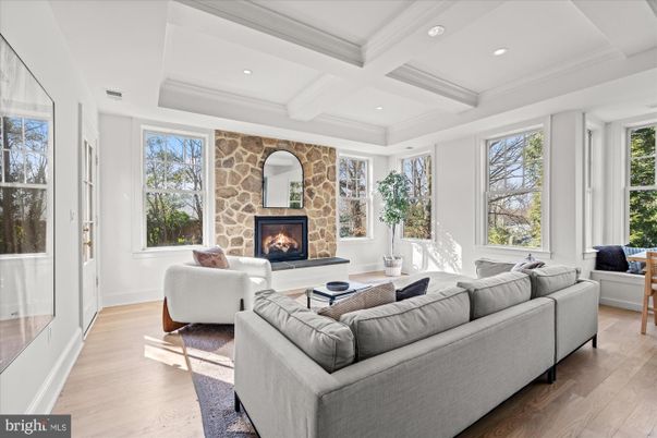 Fireplace, Interior, Living room, Recessed Lighting, Stone Walls, Wood Texture Flooring