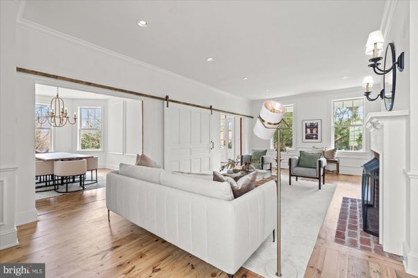 Chandelier, Dining room, Fireplace, Interior, Living room, Pendant Lights, Recessed Lighting, Wood Texture Flooring