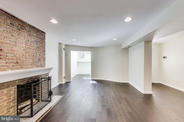 Empty room, Fireplace, Interior, Recessed Lighting, Stone Walls, Wood Texture Flooring