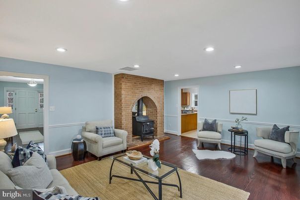 Fireplace, Interior, Living room, Recessed Lighting, Stone Walls, Wood Texture Flooring