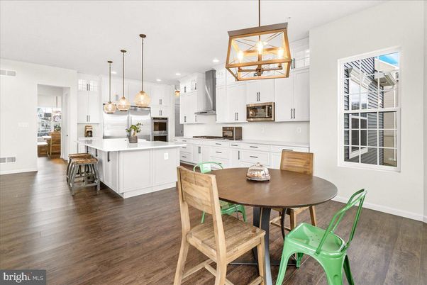 Dining room, Interior, Kitchen, Pendant Lights, Recessed Lighting, Stainless Steel Appliances, Wood Texture Flooring