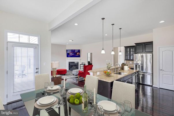 Dining room, Fireplace, Interior, Kitchen, Living room, Pendant Lights, Recessed Lighting, Stainless Steel Appliances, Wood Texture Flooring